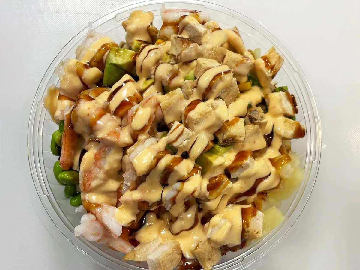 Grilled chicken and shrimp poke bowl with sauces at Lin Poke, a Hawaiian Poke Bowl Restaurant in Clearwater