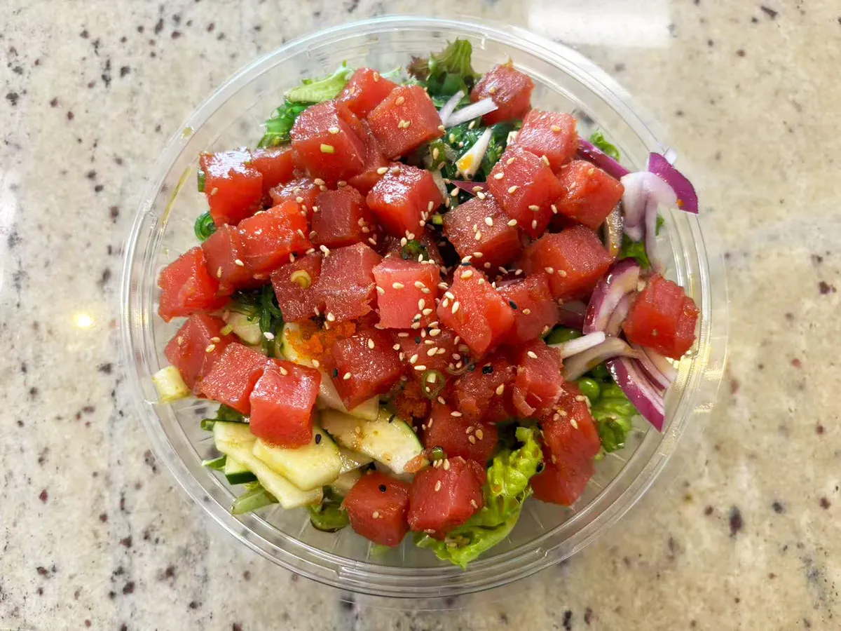 Spicy tuna poke bowl with onions and greens at Lin Poke, a Hawaiian Poke Bowl Restaurant in Clearwater