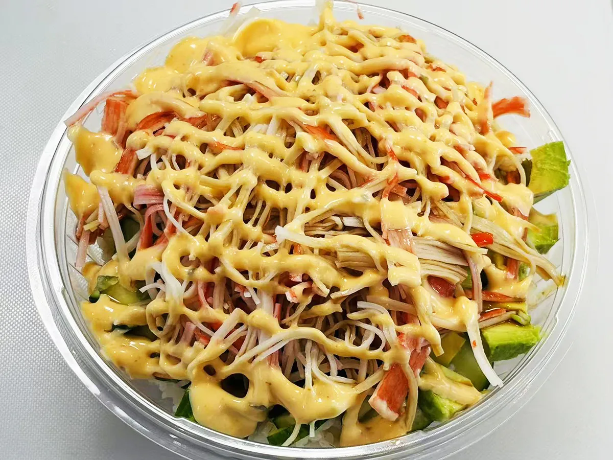 Crab stick poke bowl with yellow creamy sauce at Lin Poke, a Hawaiian Poke Bowl Restaurant in Clearwater